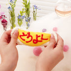 cute omurice squishy toy stretched by two hands, soft slow-rising foam for stress relief