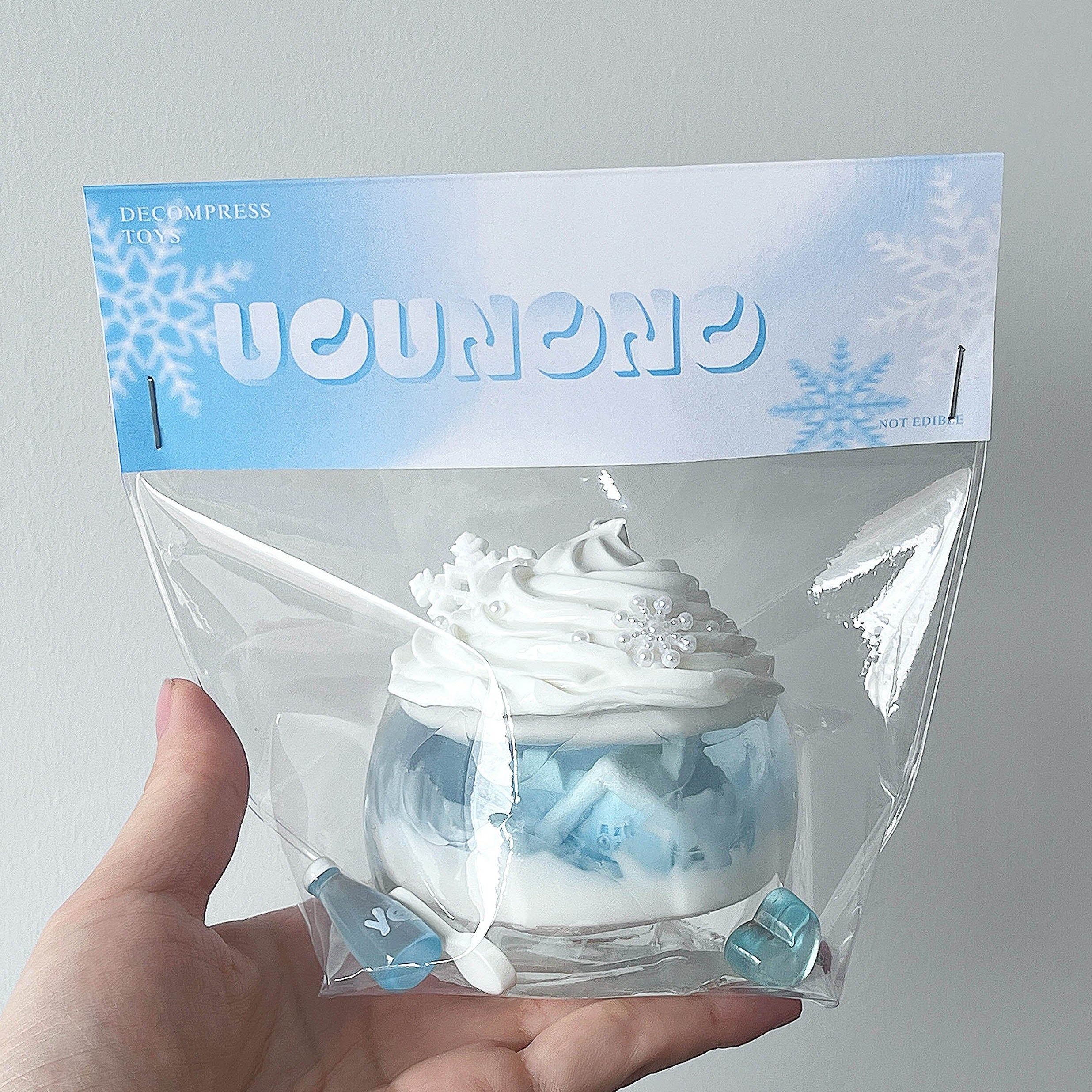 cute winter themed squishy toy with soft pastel design, cozy stress relief collectible